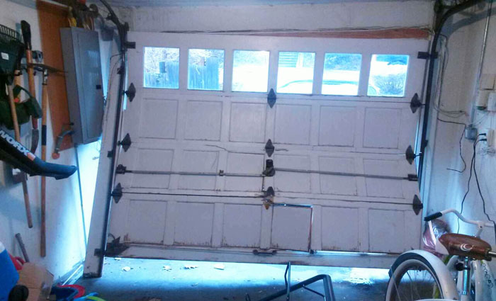 #garagedoorsrenton Broken garage door renton
